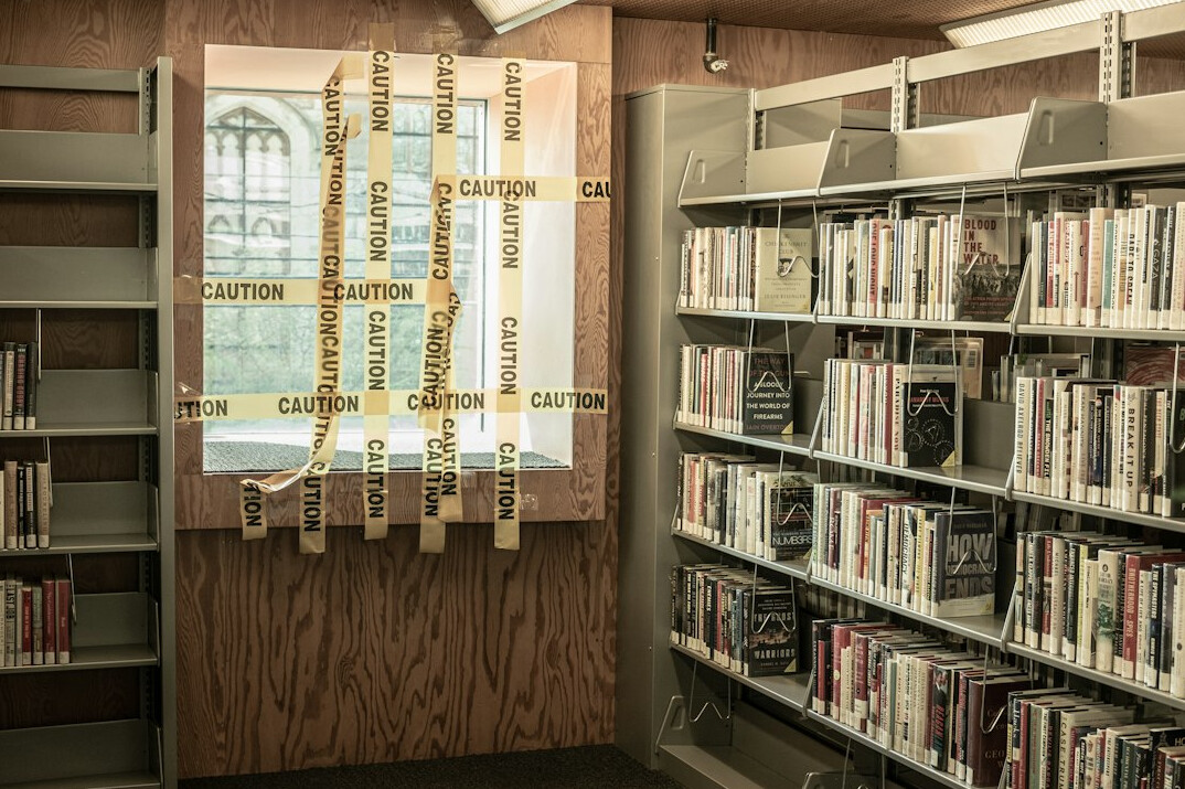 Shelves of labelled videotapes and film reels in a television archive